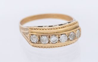 A diamond set six stone gold ring, comprising five diamonds and one replacement paste stone,