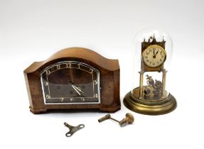 A 1930s walnut mantle clock along with an early 20th Century domed anniversary clock.