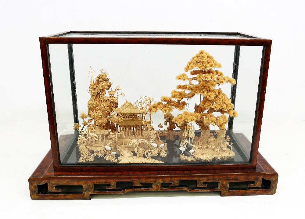 A 20th century Eastern cork diorama with Pagoda, figural and scenery design, within a glazed case