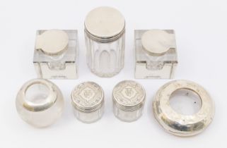 A collection of mixed silver topped or mounted dressing table or ink bottles to include; three cut