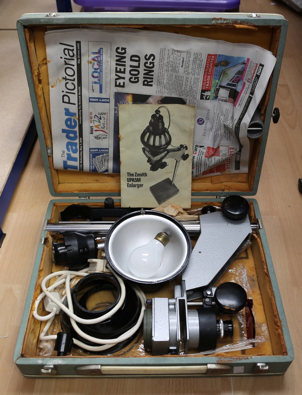 A large collection of assorted camera equipment to include: developing tanks, books, photography