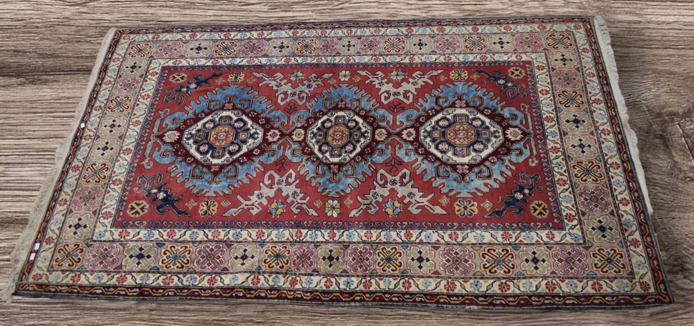 A mid 20th Century large hand knotted Iranian rug/carpet, foliage borders, three large crab