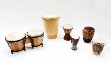 A collection of bongo drums.