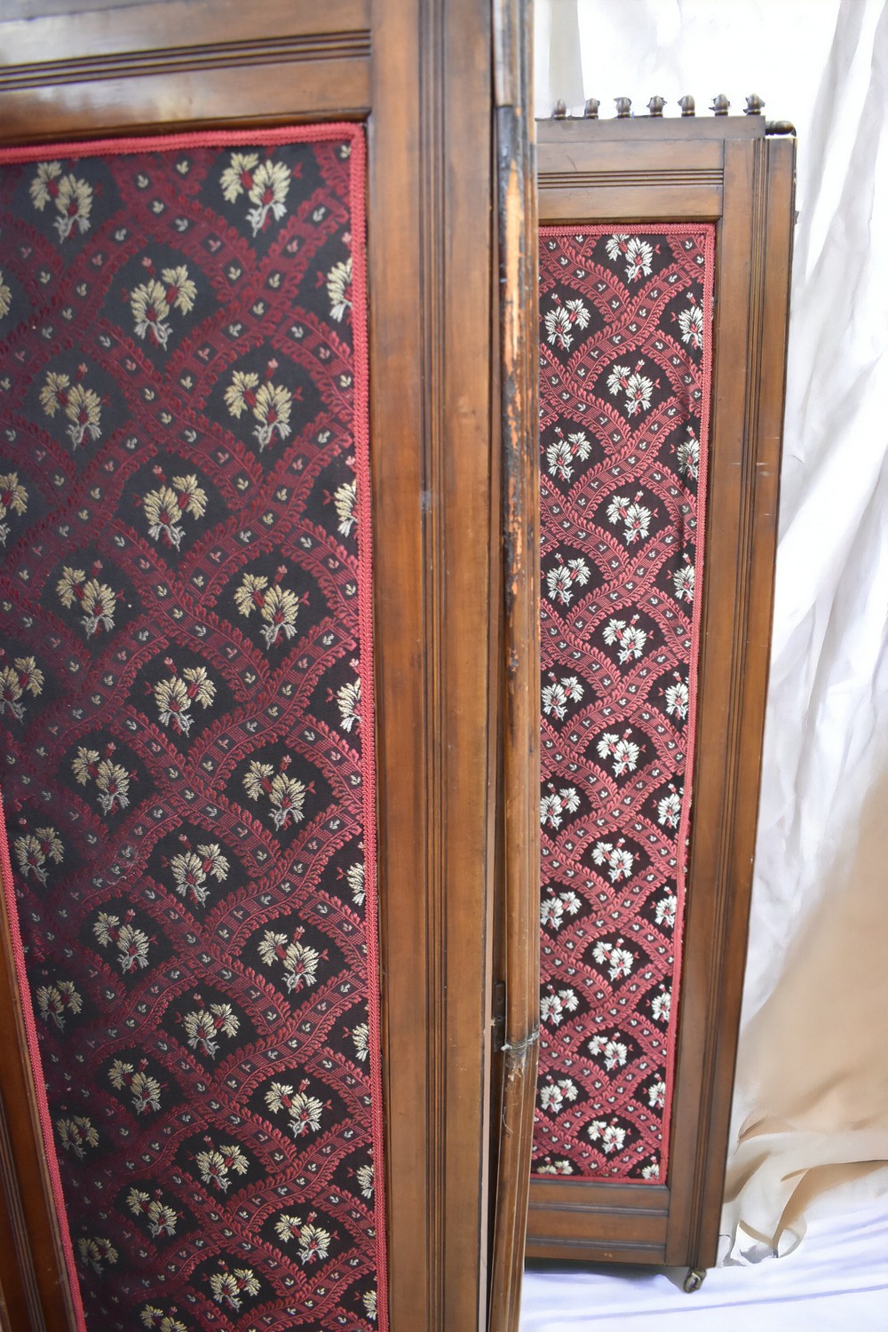 A late Victorian mahogany four panelled room screen with fabric centres along with a mid Victorian