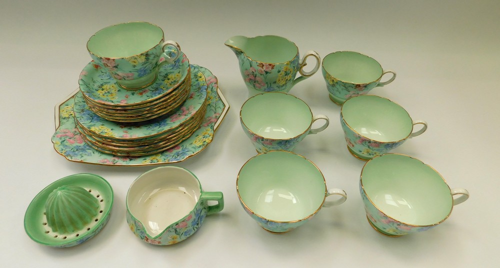 A Shelley Melody design part-tea service: 6 cups and saucers, juicer, milk jug, sandwich plate and 6