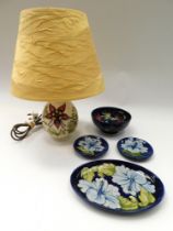 Moorcroft: a Columbine 1980s lamp with shade, an anemone blue bowl (1980s) two blue Hibiscus