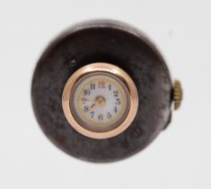 An early 20th century novelty 9ct gold gold watch modelled as a dress stud, the dial with Arabic