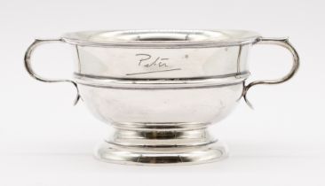 A George VI silver twin handled bowl, of circular form on circular footed base, hallmarked by