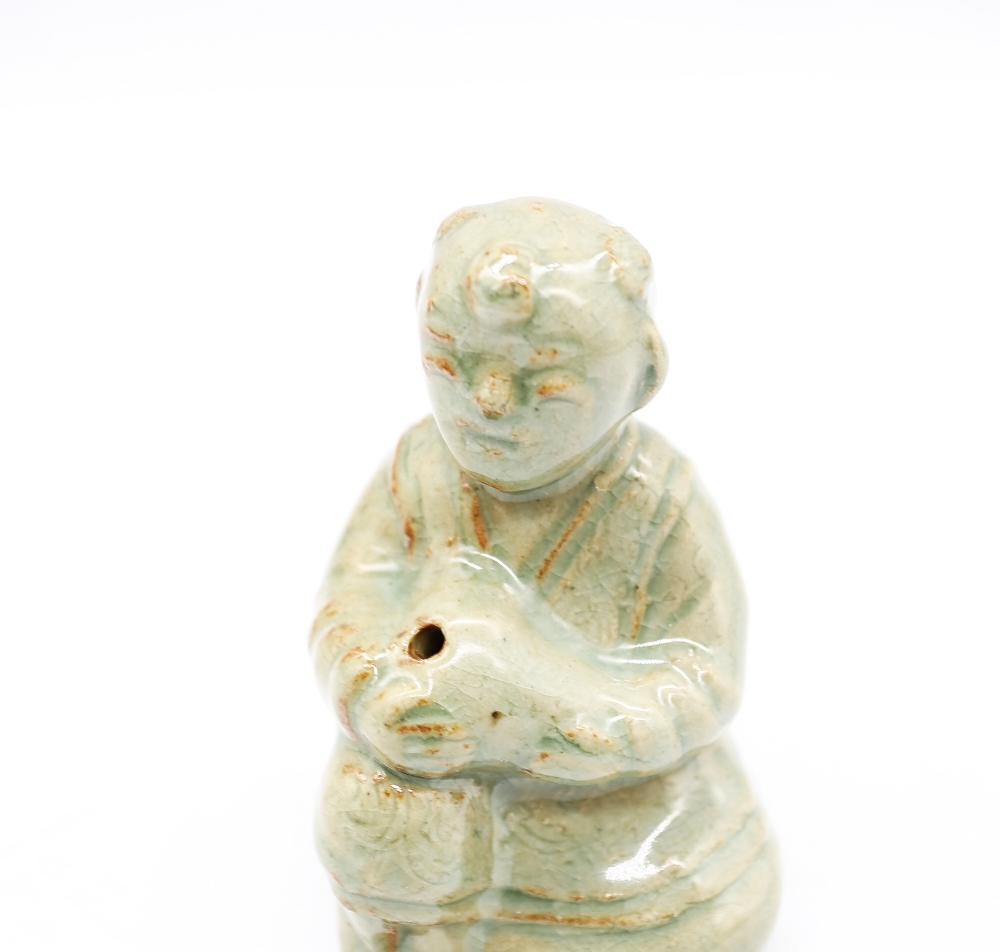 A celadon glazed stoneware human form water dropper with surface iron deposits, style of Goryeo - Image 2 of 5