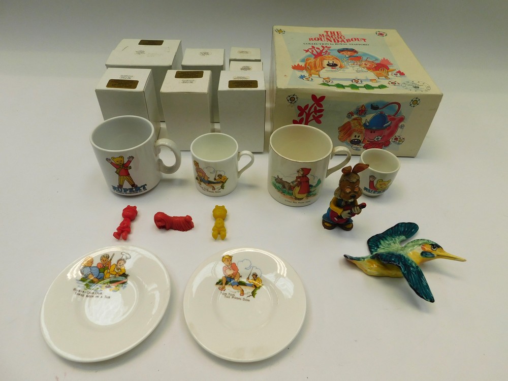 A collection of boxed Royal Stafford magic roundabout figures along with christening cups, plates