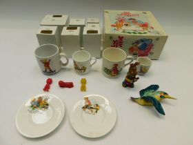 A collection of boxed Royal Stafford magic roundabout figures along with christening cups, plates