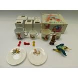 A collection of boxed Royal Stafford magic roundabout figures along with christening cups, plates