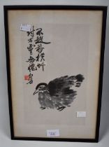 An early 20th Century Chinese water colour of a bird, framed and signed by artist.