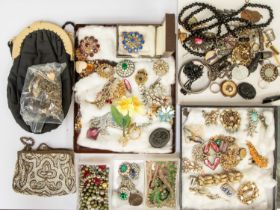 A collection of vintage costume jewellery including a Victorian Vulcanite locket, paste set
