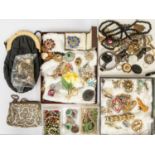 A collection of vintage costume jewellery including a Victorian Vulcanite locket, paste set