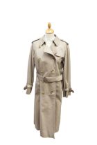 A Burberry ladies raincoat, traditional style with Burberry lining, vent at back and all buttons