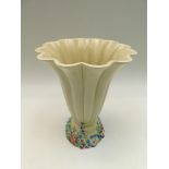 A post WWII Clarice Cliff table flower vase, 25cm tall ,chip to foot , crack to rim ,