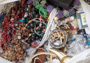 A large collection of vintage and later costume jewellery to include beaded jewellery, gilt and