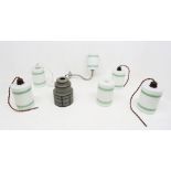 A collection of 20th century Art Deco style glass light shades to include; five matching cylindrical