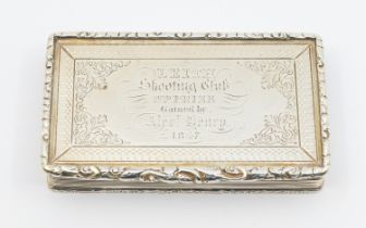 An early Victorian silver presentation snuff box, reeded sides with cast ornate border, the cover