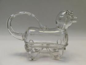 An Edwardian, circa 1905, novelty glass decanter modelled as a dog, stopper lacking, approx 25cm