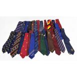 A large collection of ties to include one Guinness memorabilia, many with emblems on from clubs,