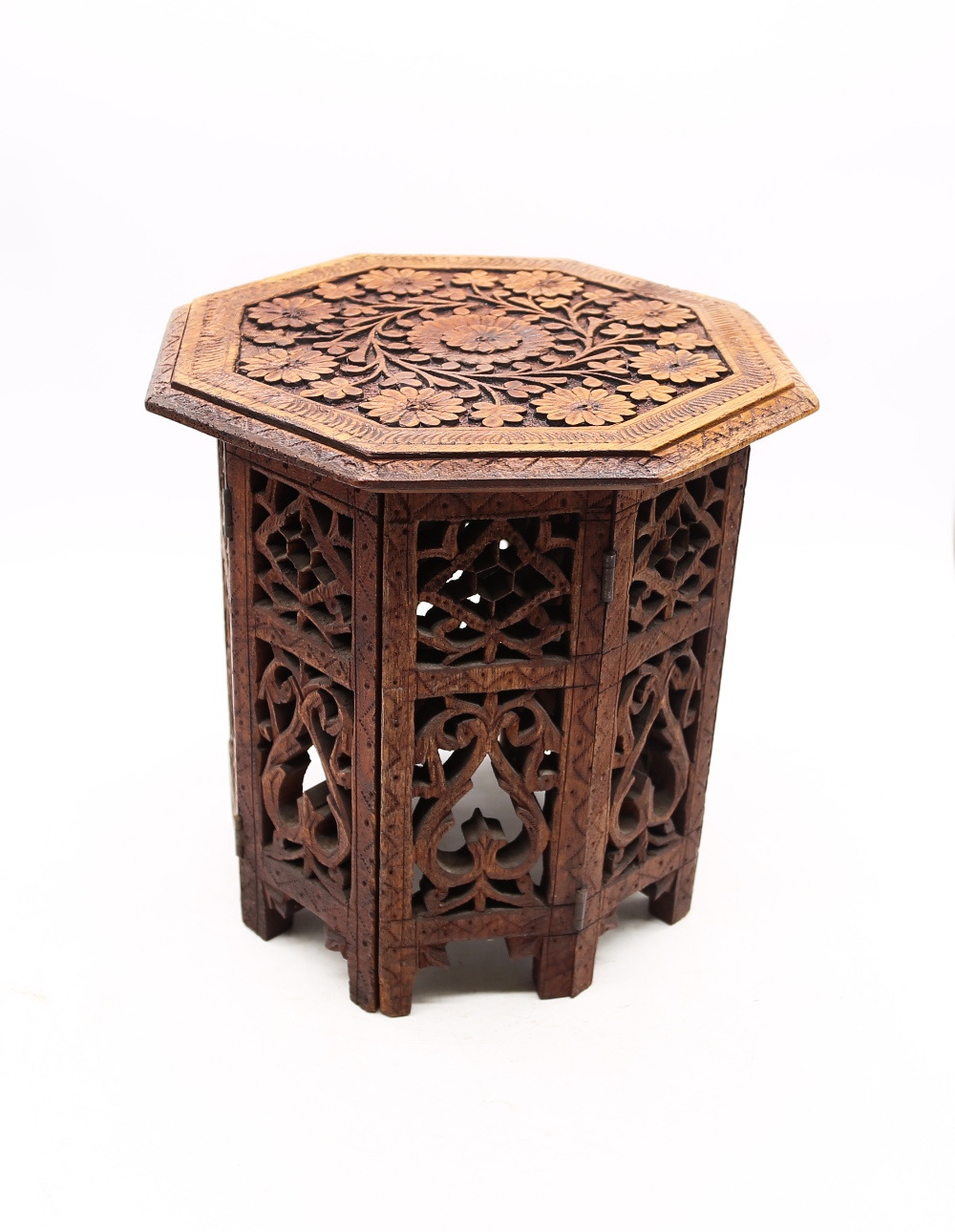 A Indian carved miniature table/stand in hardwood.