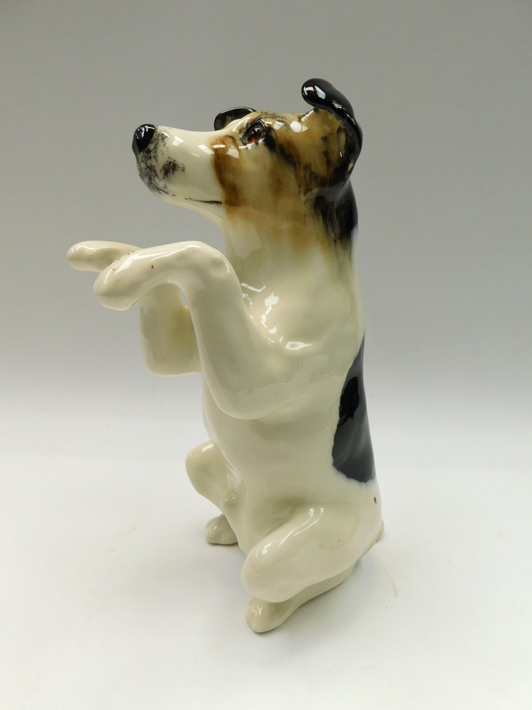 Winstanley - a 20th century ceramic model of a Jack Russell begging, glass eyes, signed to base