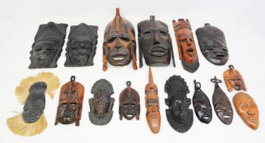 A collection of African tribal wall hanging hardwood masks.