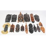 A collection of African tribal wall hanging hardwood masks.