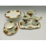 A Royal Albert Old Country Roses tea service and part-dinner service , to include teapot , sugar ,