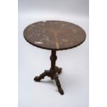 An antique Chinoiserie tilt-top table, having painted and inlaid decoration and on ebonised tripod