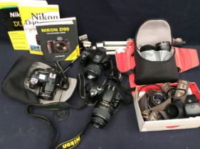 A collection of Nikon, Finepix and other cameras along with all accessories.