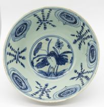 A late Ming blue and white heron and lotus bowl, circa 1600, approx. 18cm diameter x 9cm high.