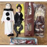 Toys: A collection of three assorted figures, included boxed porcelain doll, unboxed Pierrot doll,