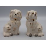 Two large Beswick King Charles Spaniels, two miniature versions, also by Beswick, along with two