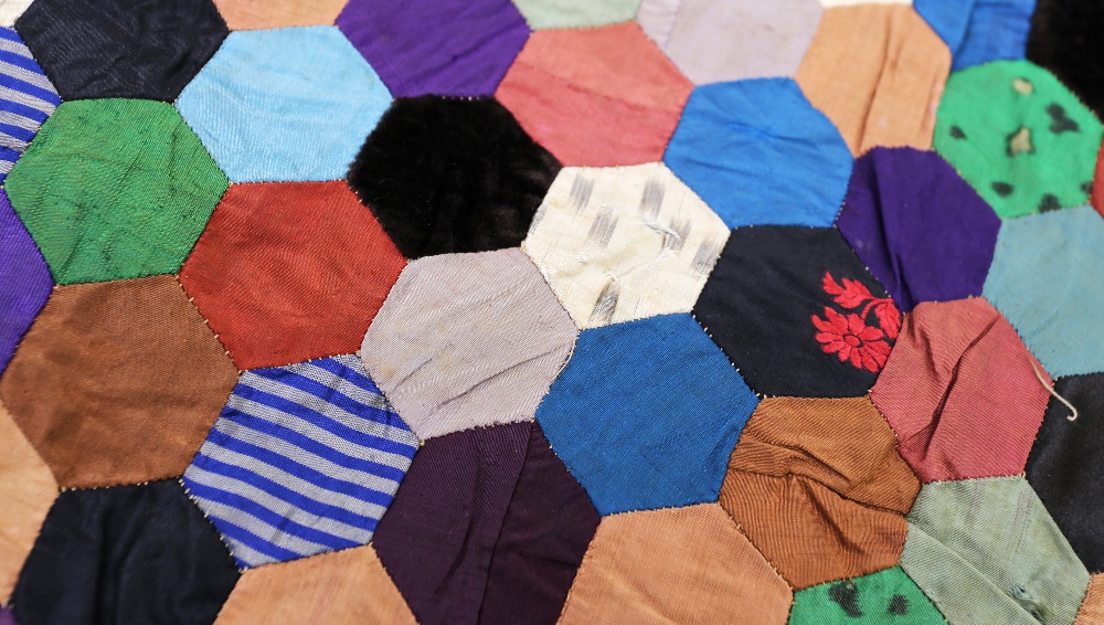 A very unusual silk quilt, c1870/80, hexagon shaped patches in a colourway of blues/gold/cream plain - Image 3 of 9