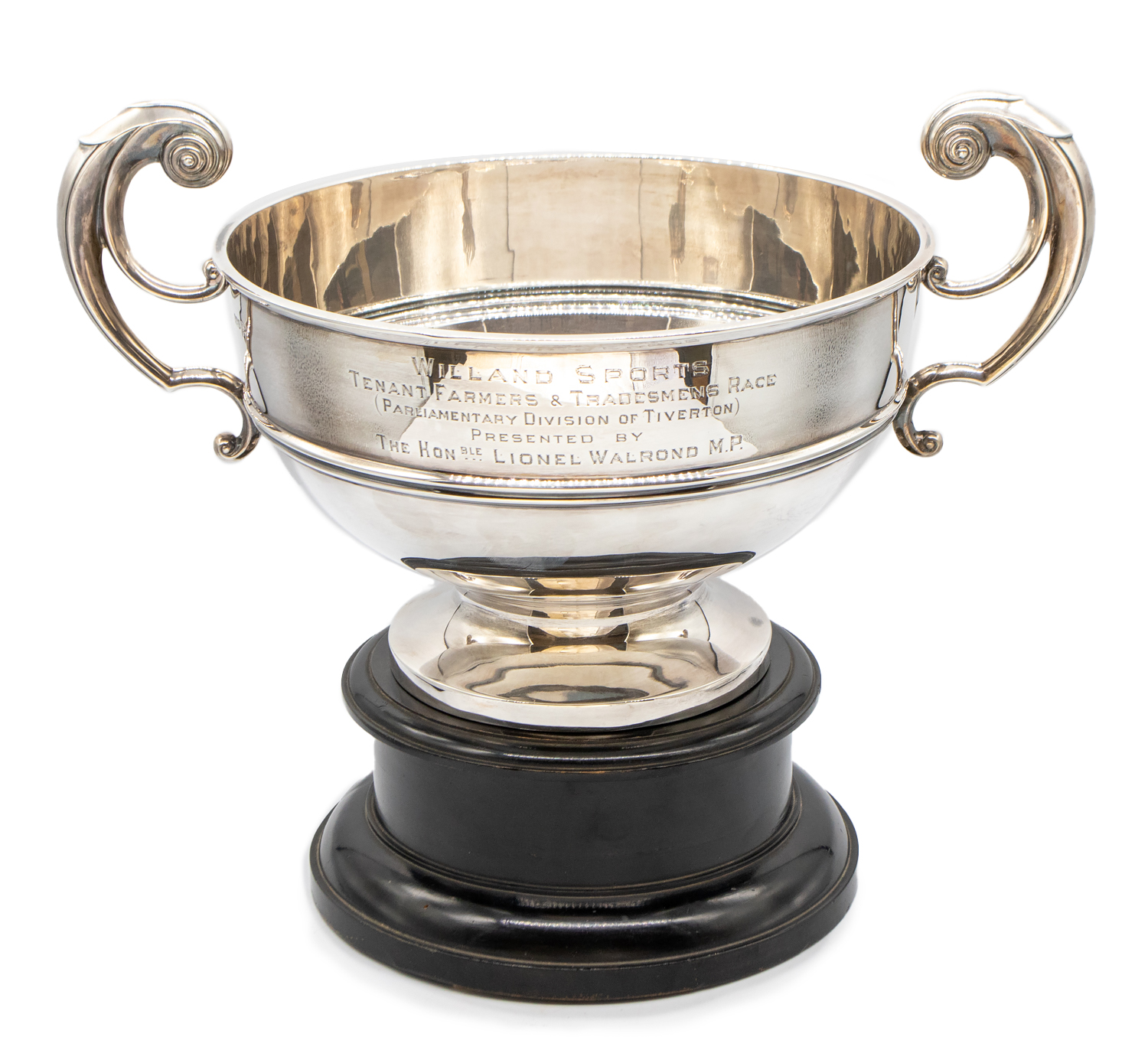 A large Edwardian silver twin handled presentation bowl, on circular footed base, engraved "
