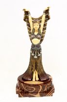 A reproduction Art Deco resin figure of a dancing lady on reproduction marble stand.