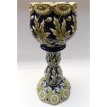 A late 19th Century jardiniere stand and planter, blue ground with floral detail , chip to foot of