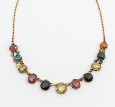 An early 20th century multi-gem harlequin gold set necklace, comprising various oval mixed cut