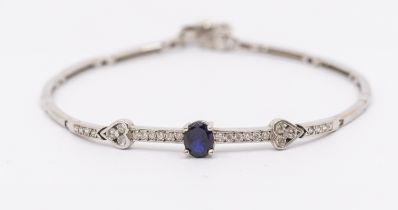 A diamond and sapphire 18ct white gold bracelet, the front set with an oval mixed cut sapphire