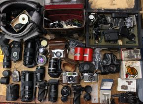 Cameras: A collection of assorted camera bodies, lenses and accessories, to include: Cosina, Contax,