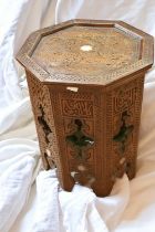 A late 20th Century North African carved table/stand.