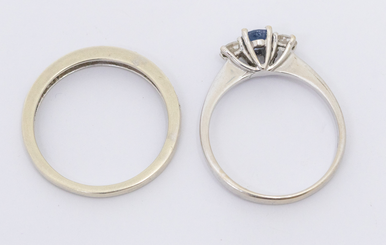 A sapphire and diamond three stone 18ct white gold ring, comprising an oval mixed cut sapphire - Image 2 of 2