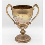 A George V silver twin handled trophy, with circular footed base and knopped stem, unengraved,
