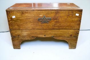 An 18th Century solid English oak bible/travelling deed box with front lifting panel, hinged door