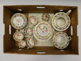 An early 19th century porcelain tea set consisting of tea pot, twin handled sugar bowl, eight tea