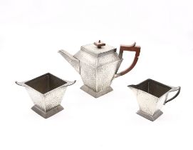 Arts and Crafts early 20th Century three piece pewter hammered tea service, Sheffield pewter.