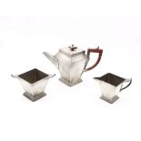 Arts and Crafts early 20th Century three piece pewter hammered tea service, Sheffield pewter.